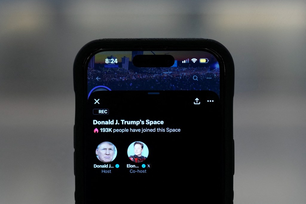 An iPhone shows Republican presidential candidate and former U.S. President Donald Trump X Space with billionaire entrepreneur Elon Musk as a co-host on the X social media network, in this illustration taken on Aug. 12, 2024.